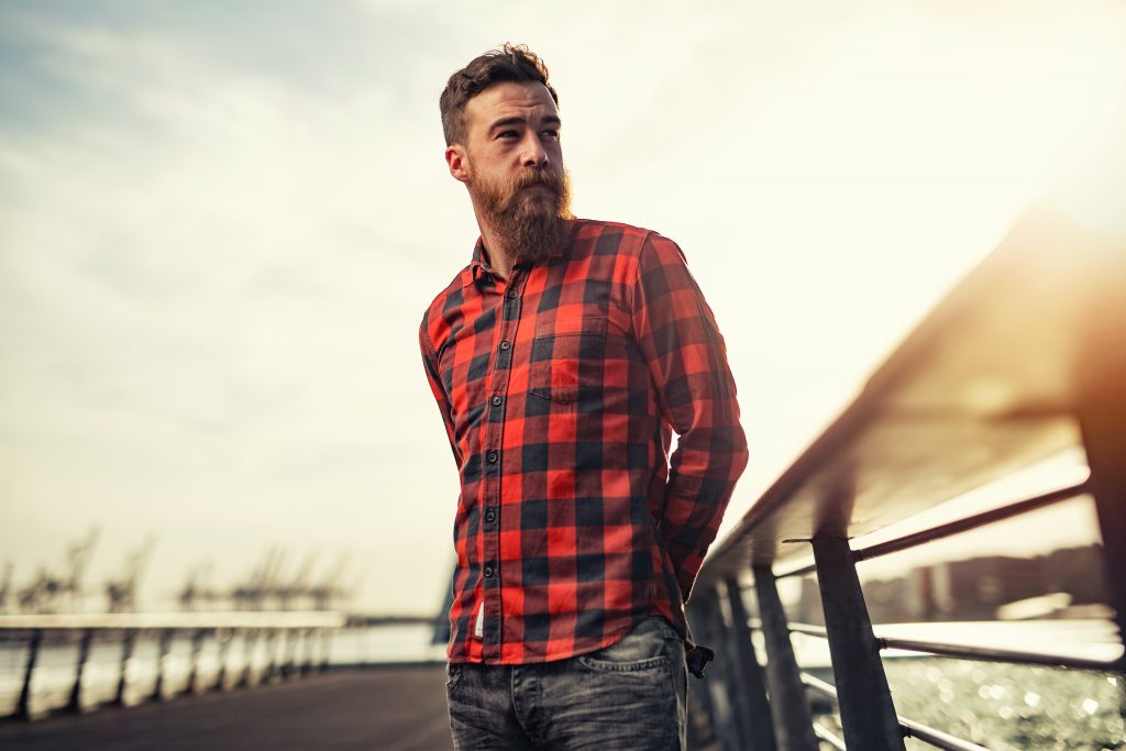 Male hipster in red shirt with beard